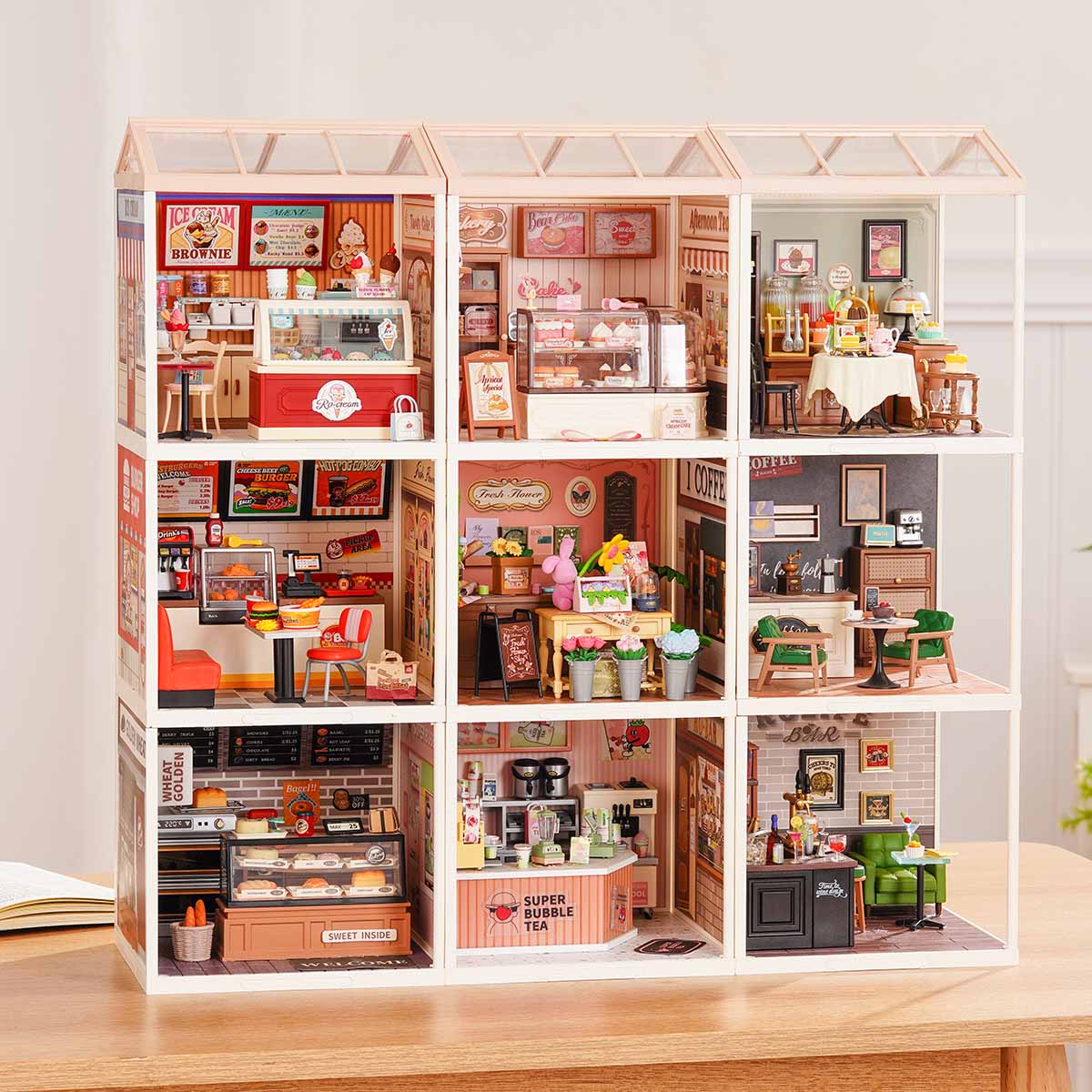 Rolife Super Creator 9 in 1 Kombination Display, das verschiedene Raumsets hervorhebt
