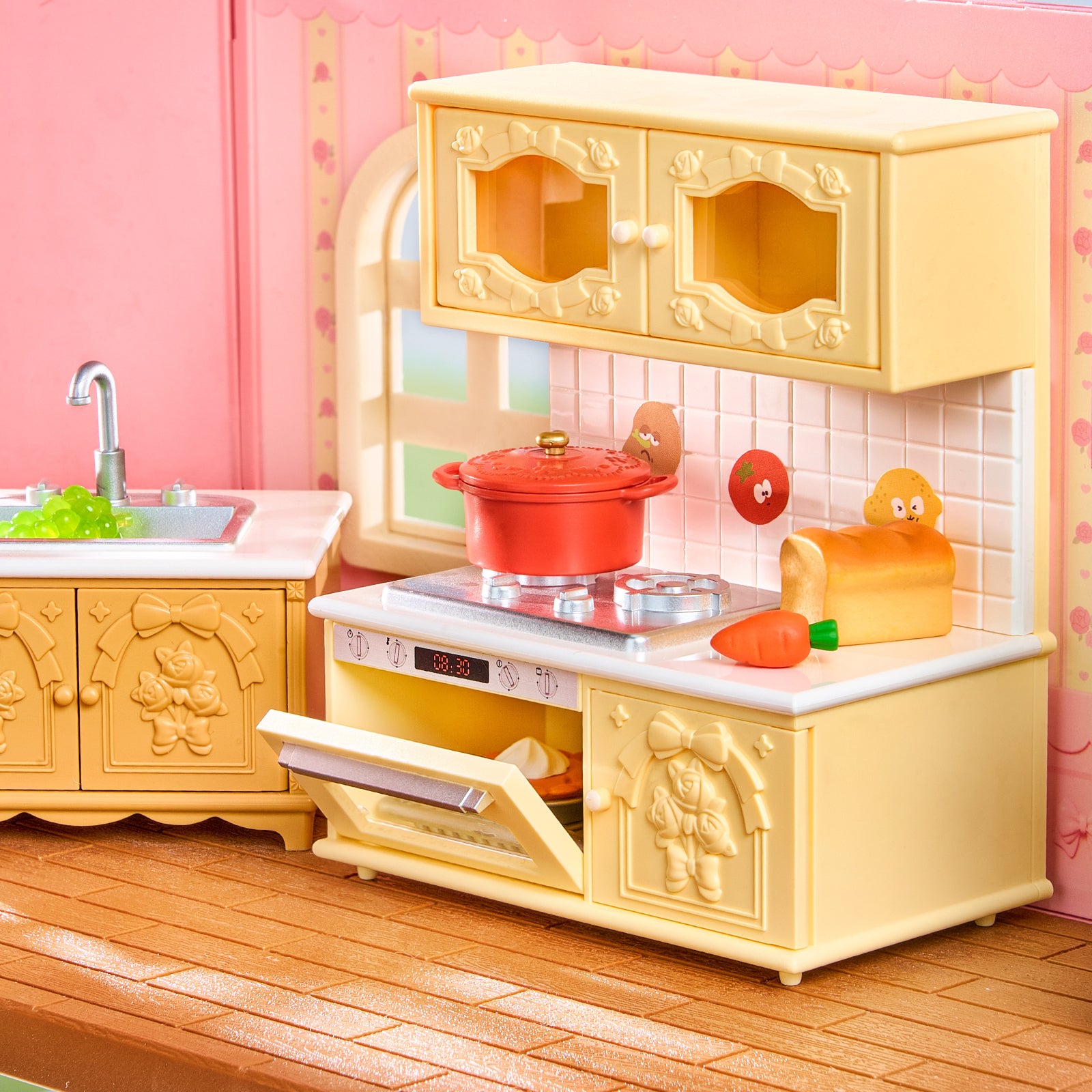 Rolife Fairy Rose Cottage HH001 kitchen detail with yellow cabinets, sink, stove, pot, and food accessories.
