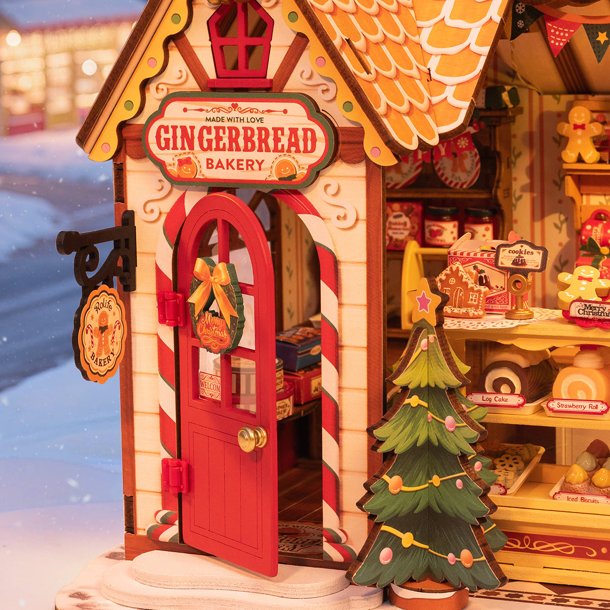 Gingerbread House DG176 close-up of the front door, signboard, and tree details