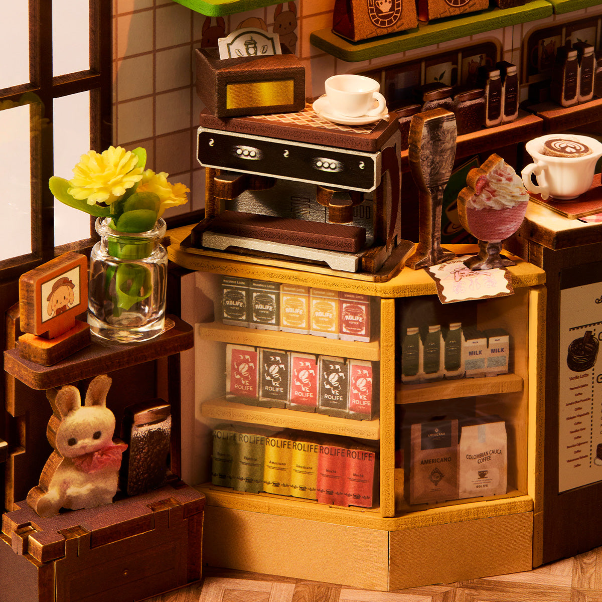 Holiday Cafe TGB15 close-up of the coffee bar, books, and rabbit figure details