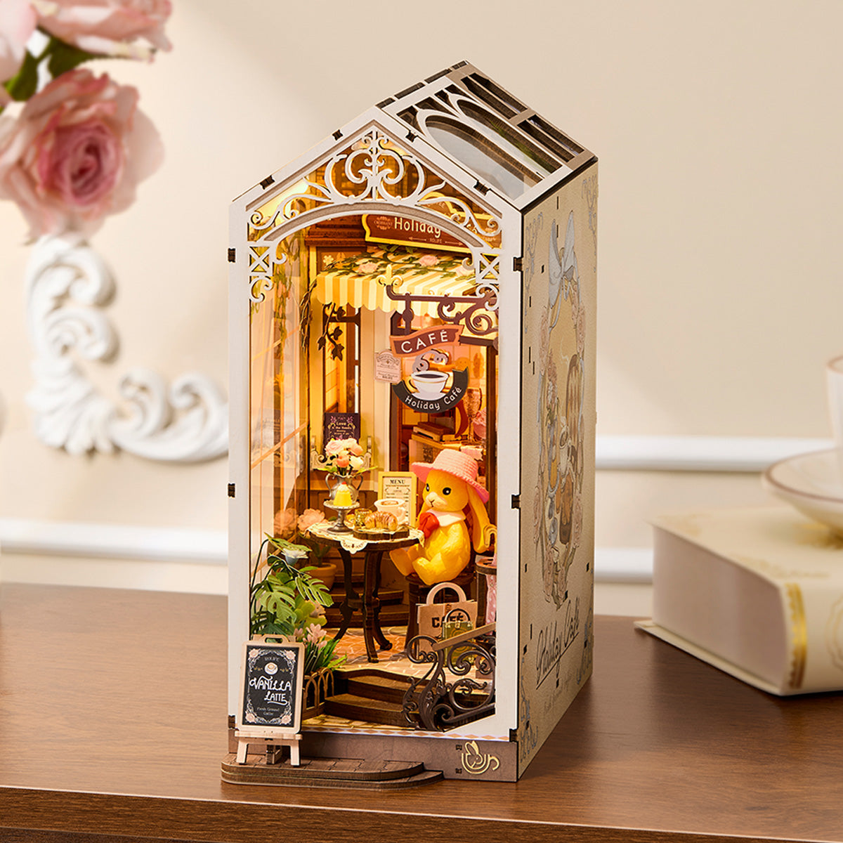 Rolife Holiday Cafe TGB15 book nook in a warm tabletop display beside books