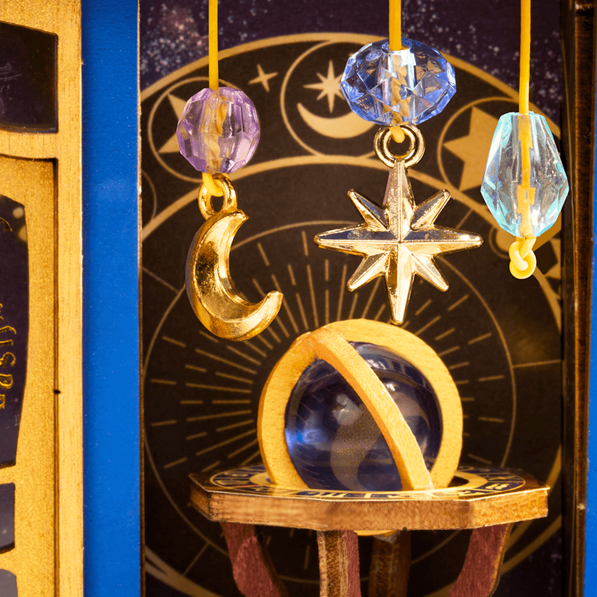 Magic Astronomy Shop DS048 close-up of hanging cosmic charms and telescope details
