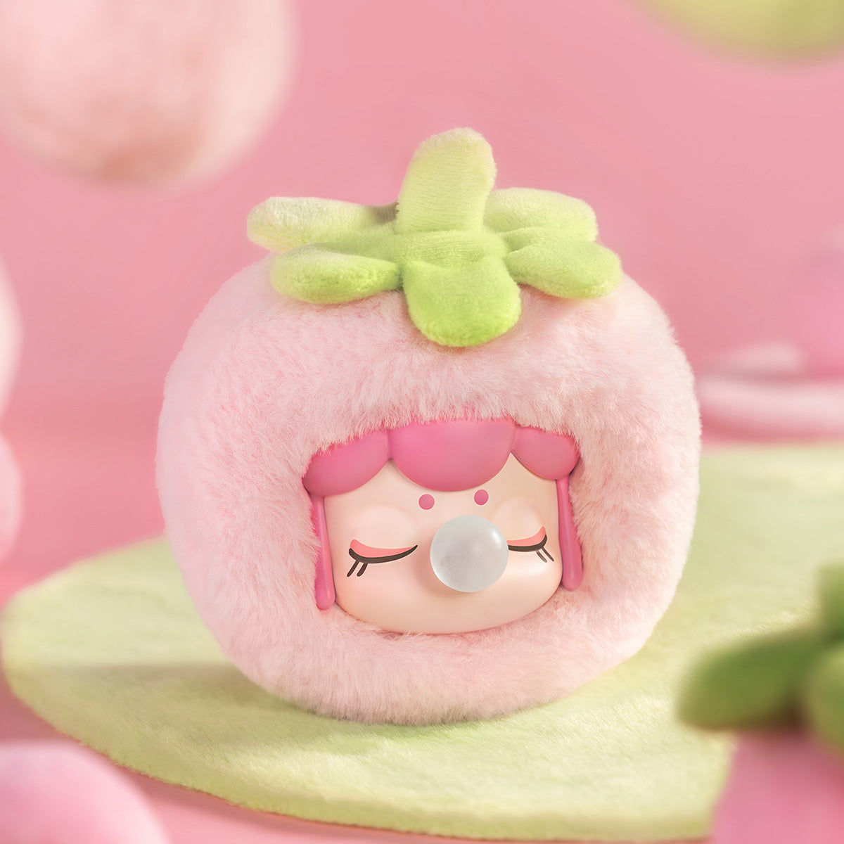 Nanci Fruit Mood Strawberry plush pendant on a soft pink background