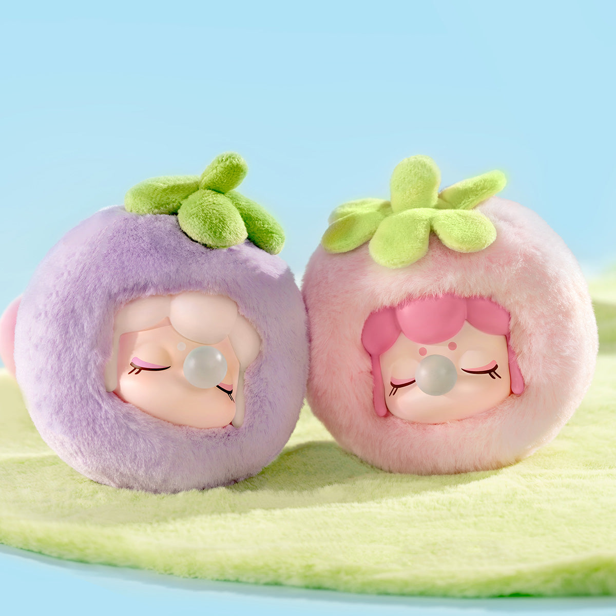 Nanci Fruit Mood pair display with Pear and Strawberry plush pendants
