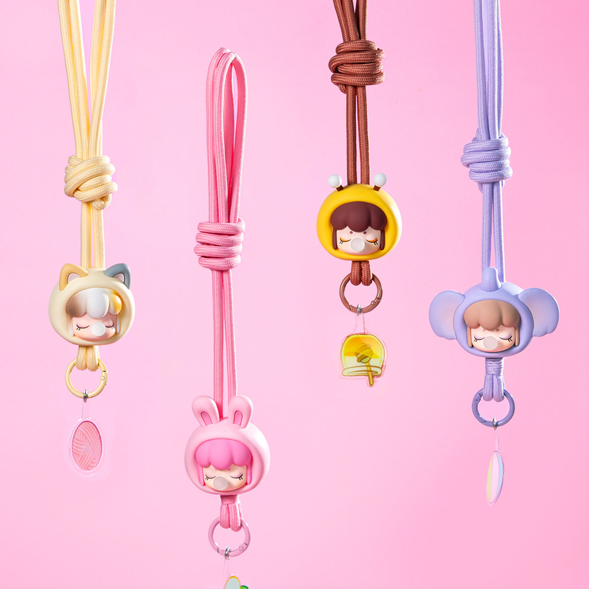 Baby Nanci Fluffy Party phone chain collection display on a pink background