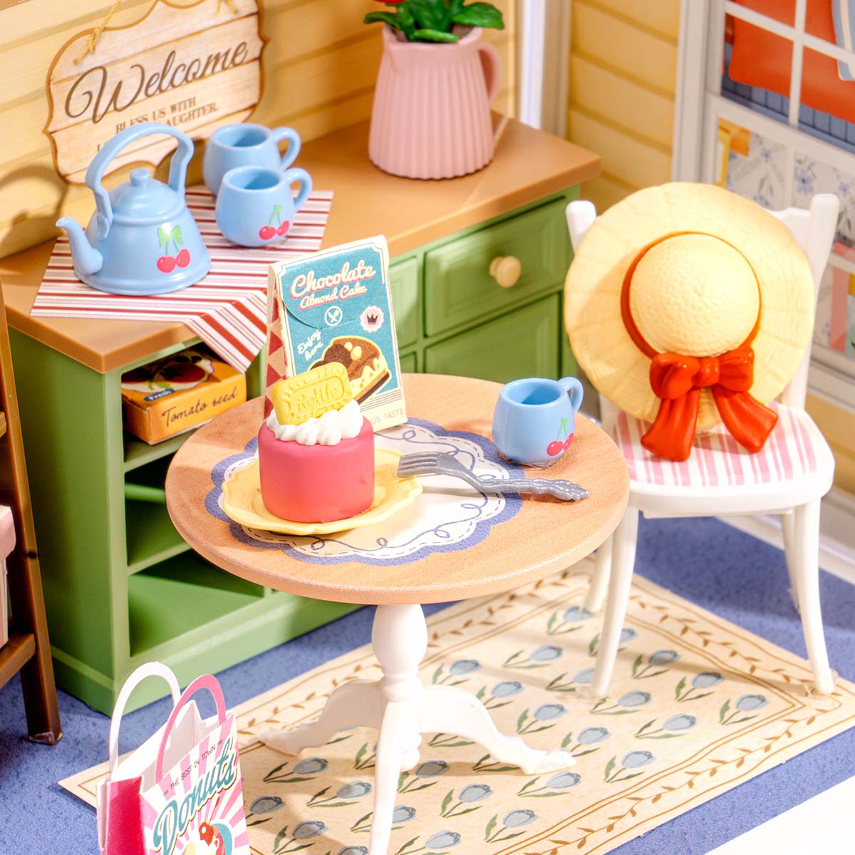 Sonnenstrahlen Sip Porch DWS07B Nahaufnahme des Teetisches, der Kuchen- und Stuhldetails