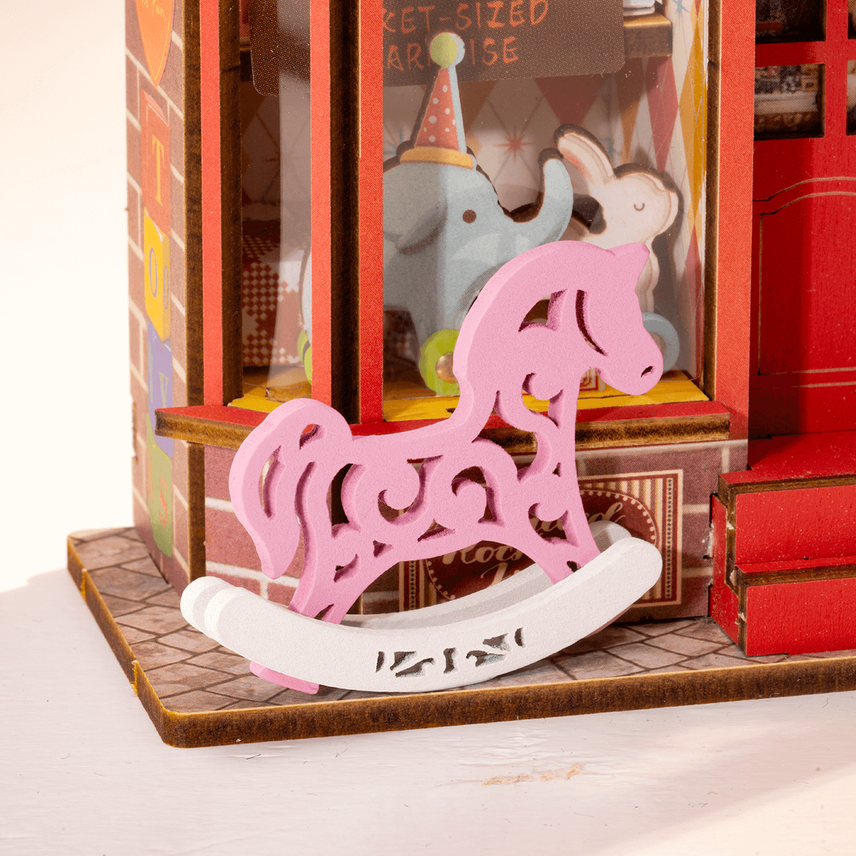 Whimsy Toy Shop DS044 close-up of rocking horse display by the storefront entrance