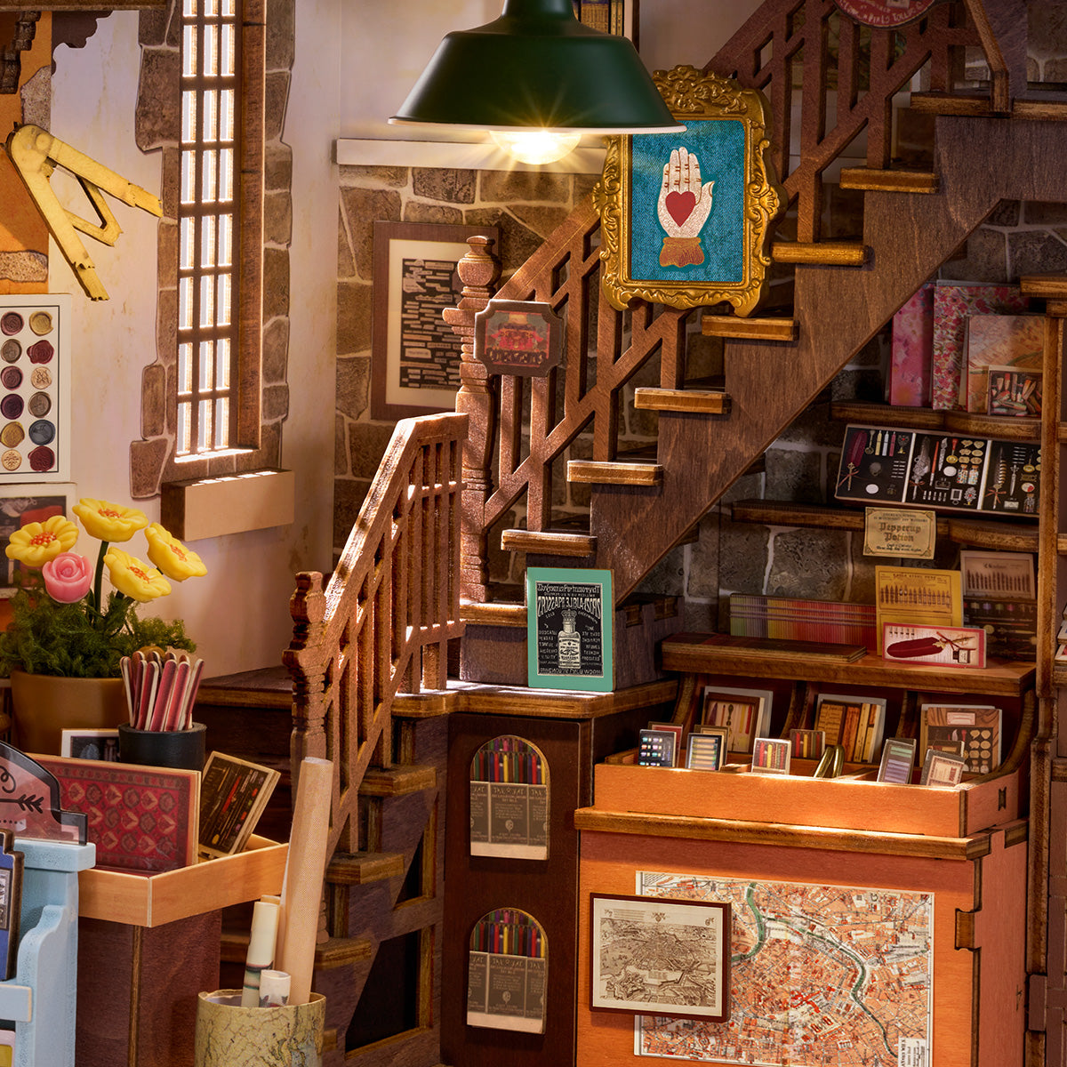 Close-up of the lighted staircase, shelves, and map counter inside the Wisdom Stationery Shop book nook