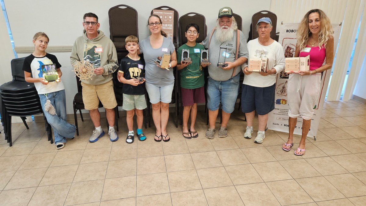 Eight makers holding their projects at the Copperas Cove Robotime meetup