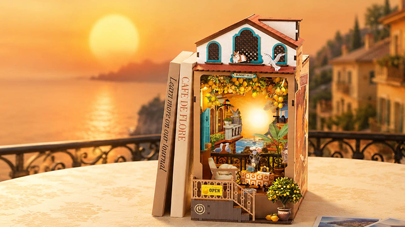 Create a cozy seaside escape glowing in the warmth of sunset.
