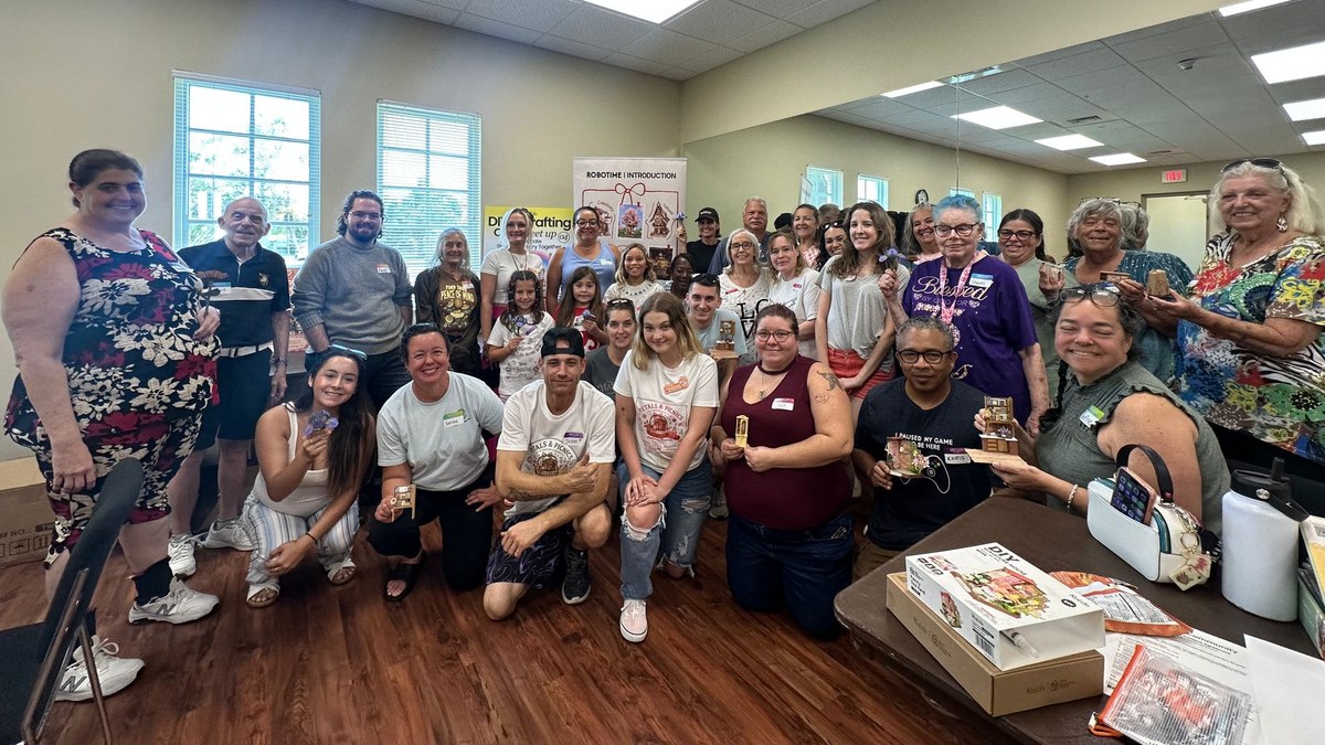 Petals and Picnics participants holding miniature projects in Venice, Florida