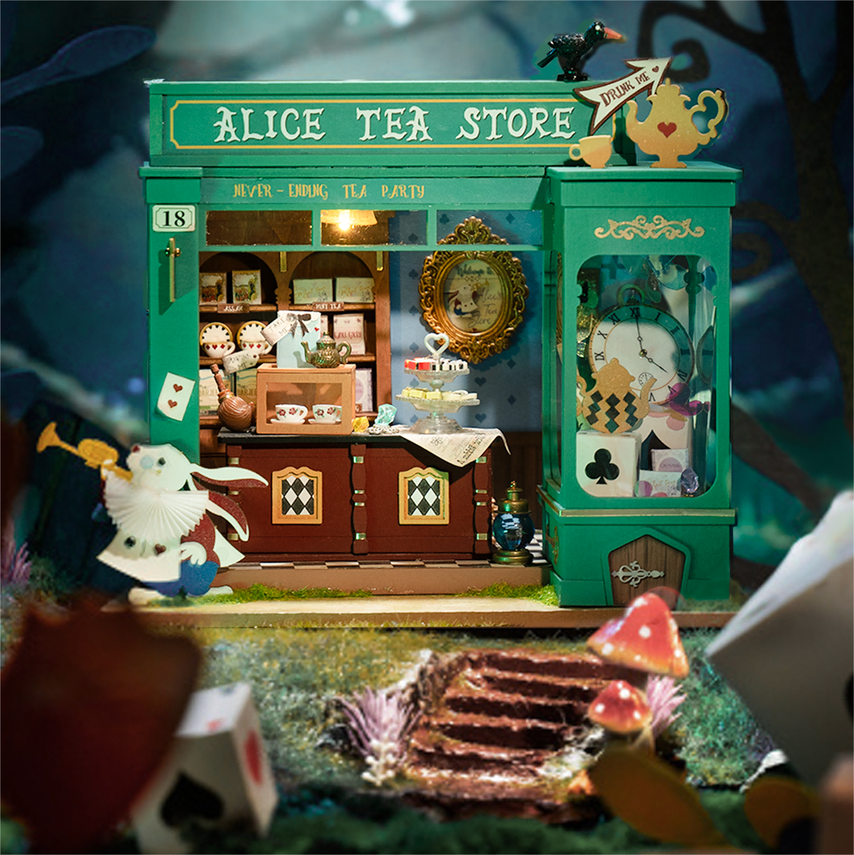 Escena de exhibición de mesa de la tienda de té de Alice DG156 con fachada en color azul verdoso y figura de conejo